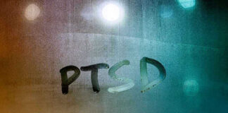 PTSD written on a foggy glass surface