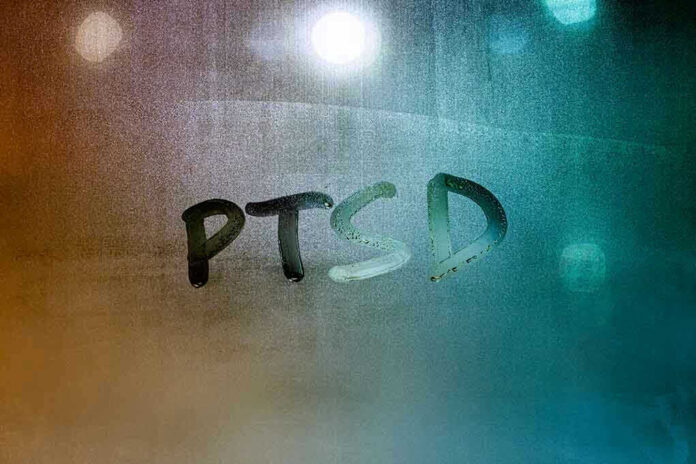 1890075040 PTSD written on a foggy glass surface
