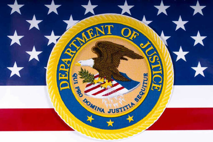 1054857686 Department of Justice seal on American flag background