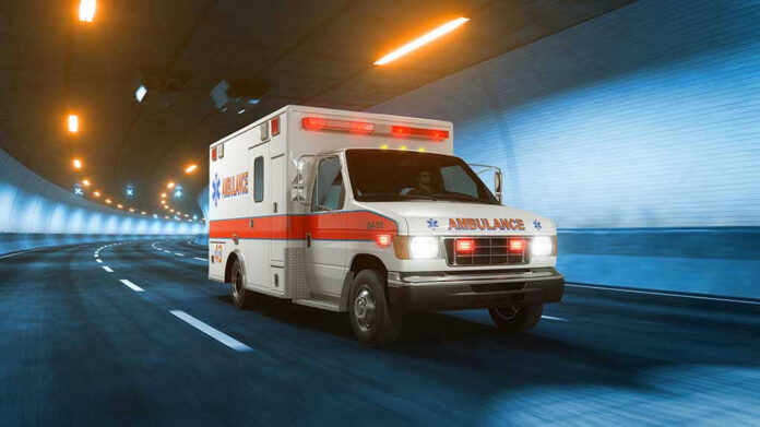Ambulance driving through a brightly lit tunnel