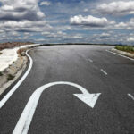 Trump FLIPS – Orders Full Epstein Disclosure NOW Curved road with a U-turn arrow marking.