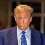 Trump THREATENS Indiana GOP — Primary Purge Incoming Man in blue suit and striped tie, serious expression.