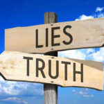 SHOCKING Twist — ICE Lie Unraveled Signs pointing to Lies and Truth against sky.