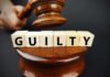 Uncle FIRES 10 Shots Over Chicken Payment A gavel striking down next to wooden blocks spelling 'GUILTY'