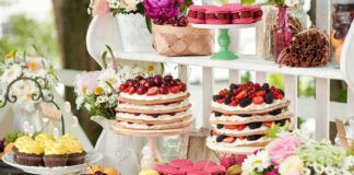 A beautifully arranged dessert table featuring various pastries and fruits