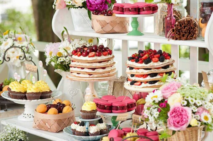 shutterstock_150892259.jpg A beautifully arranged dessert table featuring various pastries and fruits