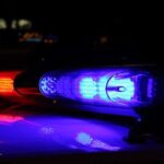 Justice System MELTDOWN After LA Double Murder Close-up of police lights flashing in blue and red at night