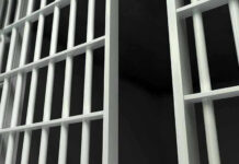 25 Years STOLEN — Innocent Man Finally Freed Close-up of prison cell bars.