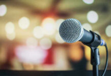 Microphone with blurred lights in the background.
