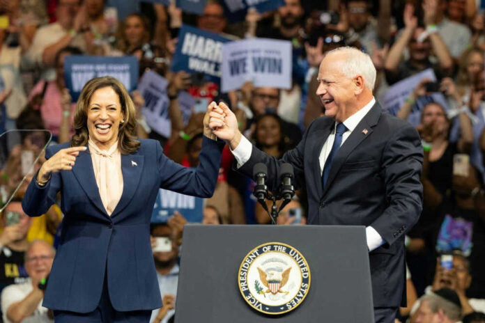 Two people holding hands at a campaign rally. Two people holding hands at a campaign rally.