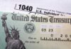 Close-up of a U.S. Treasury check and tax form 1040
