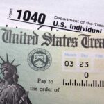 Close-up of a U.S. Treasury check and tax form 1040