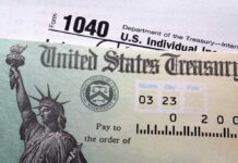 Close-up of a U.S. Treasury check and tax form 1040