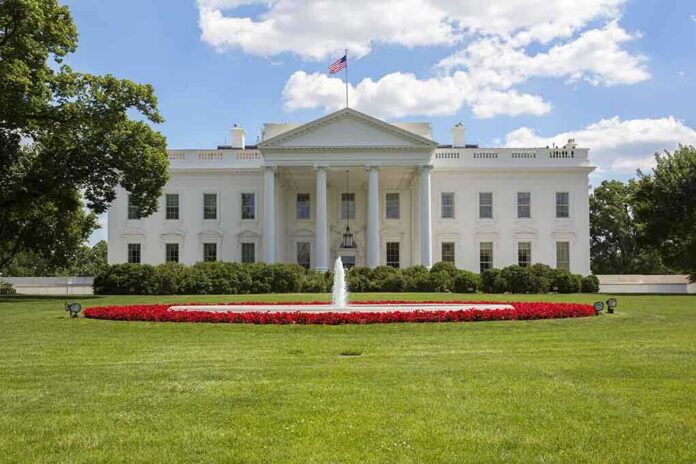 The White House with a fountain and flower beds in front