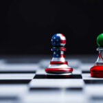 Chess pieces with USA and Iran flags on board.