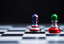 Former Minister’s BOMBSHELL Proposal Stuns Washington Chess pieces with USA and Iran flags on board.