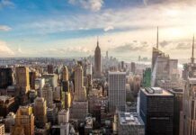 Aerial view of New York City skyline featuring the Empire State Building at sunset