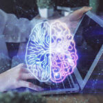 Vatican’s Bold Stand: Disarm AI Weapons! Futuristic AI brain hologram above a laptop computer.