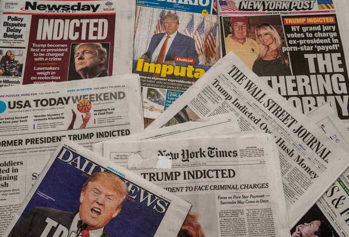 Newspaper headlines about Trumps indictment.