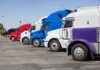A lineup of colorful trucks parked in a lot