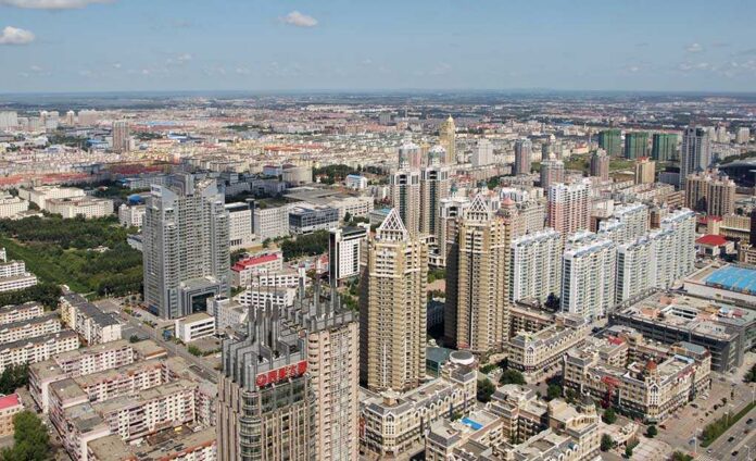 The,City,Harbin,(china).,The,Top,View Aerial view of a sprawling urban city with high-rise buildings and green spaces