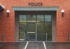 Entrance of a modern police station with brick facade