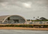 Third Marine Suicide—Then This? Aircraft hangar with helicopters near the beach.