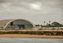 Third Marine Suicide—Then This? Aircraft hangar with helicopters near the beach.