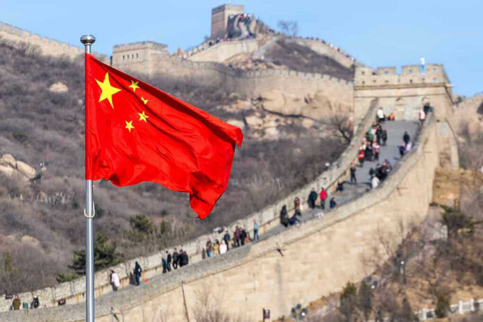 1145455832 Chinese flag by the Great Wall of China.