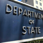 Vance vs Obama: Same Play, New Twist? Department of State sign in front of building.