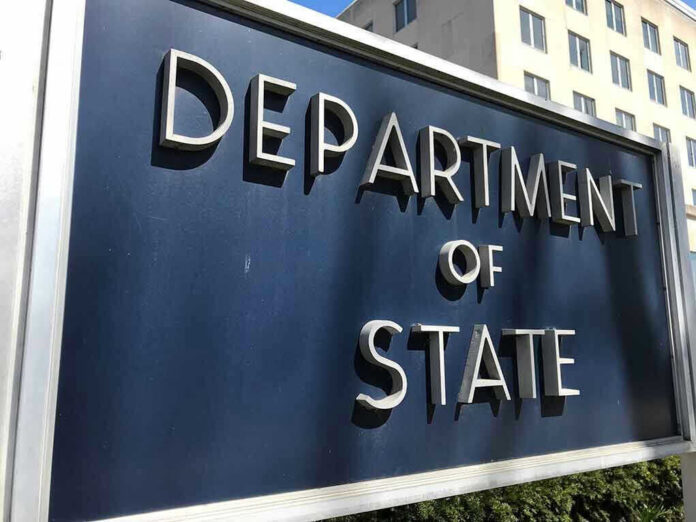 1269820630 Department of State sign in front of building.