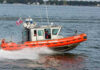 Coast Guard Fires Shots at Fleeing Boat Coast Guard boat speeding on the water.