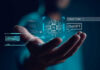 Hand holding digital AI and ChatGPT graphics.