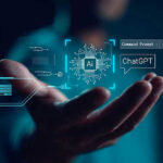 Federal AI Crackdown Looms Hand holding digital AI and ChatGPT graphics.