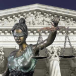 Crowdfund War Erupts After Murder Verdict Lady Justice statue in front of courthouse.