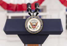 Democrats Meltdown After Trump’s Iran Deal Vice Presidential podium with microphones and emblem.