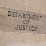 DOJ Targets Newsom—What’s The Play? Department of Justice sign on a building.