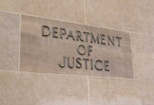 DOJ Targets Newsom—What’s The Play? Department of Justice sign on a building.