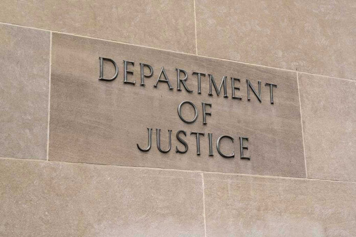 693016663 Department of Justice sign on a building.