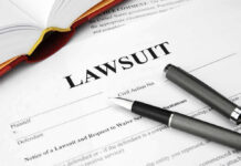 Legal document titled Lawsuit with pen and book.