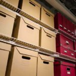 FBI Purge Over Anti-Catholic Memo Shelves filled with brown and red storage boxes for organizing documents