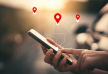 Phone Data Dragnets SMACKED Down Person using a smartphone with location markers displayed on the screen