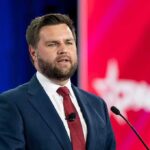 From Vicodin To Heroin: A Mom’s Reckoning A man in a suit delivering a speech at a conference