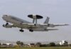 NATO AWACS aircraft taking off from an airfield