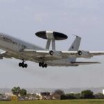 Trump Yanks Firepower, Allies Scramble NATO AWACS aircraft taking off from an airfield