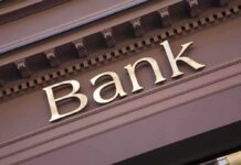 Trump Targets Cartel Cash—Banks Brace Close-up of a bank sign with gold lettering