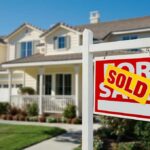Rigged Housing Game Exposed A house with a Sold sign in the front yard