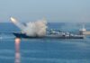 Gulf Sirens Scream As Barrage Begins A military ship launching a missile into the ocean