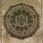 FBI Victory Lap — Where’s The Breakdown? FBI seal on a marble wall.