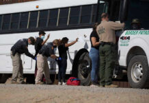 Kansas City Trafficking Sting: Numbers Stun Border patrol officers investigating people near a bus.